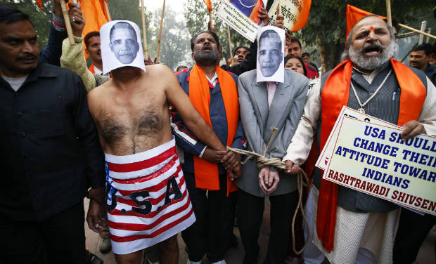 Supporters of Shivsena walk with people representing U.S. President Barack Obama near the U.S Embassy to protest against the alleged mistreatment of New York based Indian diplomat Devyani Khobragade, in New Delhi on Wednesday - AP Supporters of Shivsena walk with people representing U.S. President Barack Obama near the U.S Embassy to protest against the alleged mistreatment of New York based Indian diplomat Devyani Khobragade, in New Delhi on Wednesday - AP